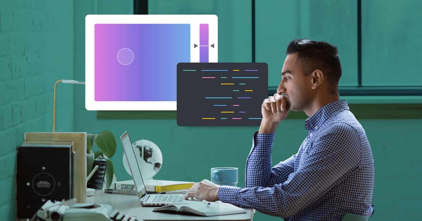 man sitting at desk as he codes background colors into his html email background color