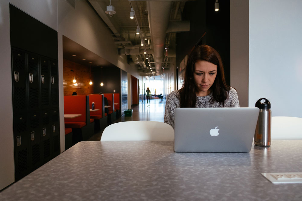 Photo of woman looking at a laptop computer