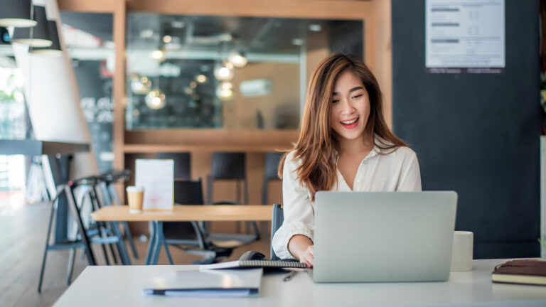 person-smiling-at-screen